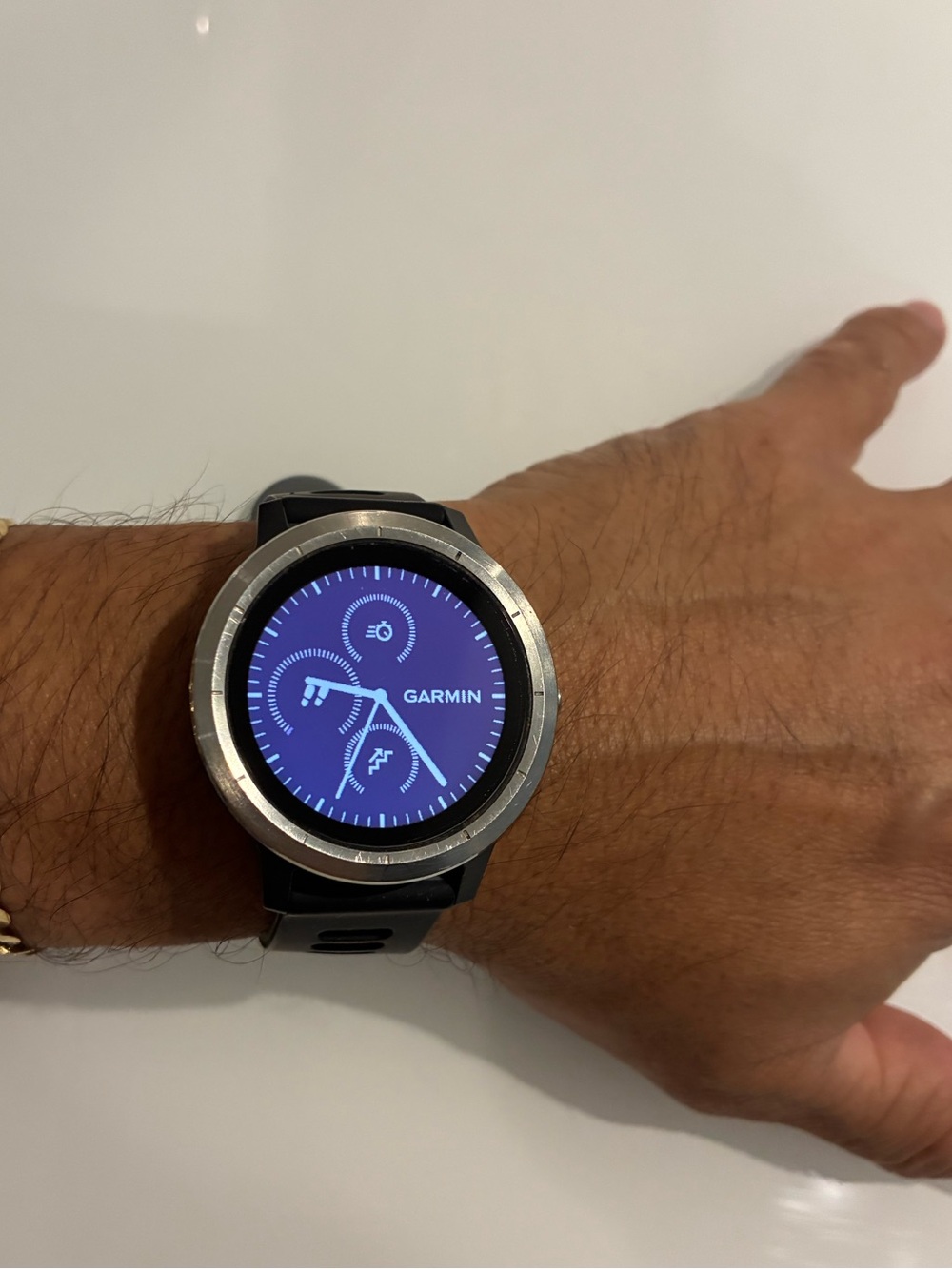 garmin Black Smartwatch with Silver Bezel and Blue Display